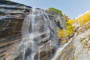 Picturesque Alpine waterfall, Grossglockner High Alpine Road in Austrian Alps.