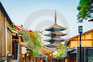 Picturesque Ancient Pagoda Peaks in Historic Japanese Street Lined with Blooms