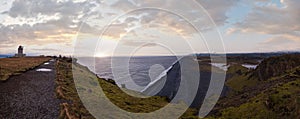 Picturesque autumn evening view to endless ocean black volcanic sand beach from Dyrholaey Cape Viewpoint, Vik, South Iceland