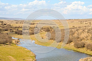 Picturesque autumn landscape of river and blue sky