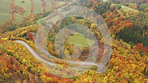 Picturesque autumn landscape with road between the hills. Czech Republic