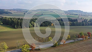 Picturesque autumn landscape with road between the hills. Czech Republic