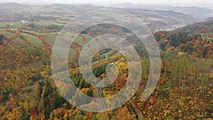 Picturesque autumn landscape with road between the hills. Czech Republic