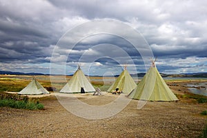 Picturesque autumn landscape with the tepees