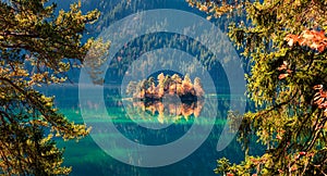 Picturesque autumn scene of Eibsee lake. Colorful morning view of small island on bottom of the Zugspitze peak, Bavaria, Germany,