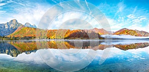 Picturesque autumn scene of sunny morning on Almsee lake. Poppular travell destination