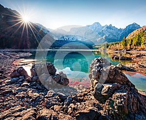 Picturesque autumn view of Fusine lake. Splendid morning scene of Julian Alps with Mangart peak on background, Province of Udine,