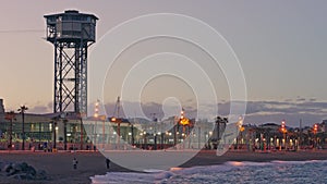 A picturesque beach with a majestic tower overlooking the vast ocean