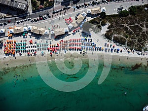 Picturesque beach scene with a variety of brightly colored umbrellas at Praia dos Anjos