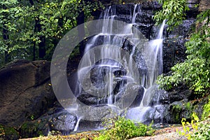 Picturesque beautiful waterfall falls from stones in Sofievsky park, Uman, Ukraine