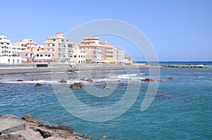 Picturesque black pebble beach in Las Galletas on the south of Tenerife photo
