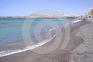 Picturesque black pebble beach in Las Galletas on the south of Tenerife photo