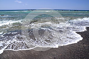 Picturesque black pebble beach in Las Galletas on the south of Tenerife