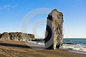 Picturesque black sand volcanic beach at summer, south Iceland