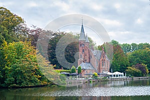 Picturesque castle near Minnewater Lake in the old town of Bruges photo