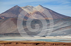 The Picturesque Cerro Medano Mountain with Salar de Talar Salt Lake in the Foreground, Atacama desert, Chile photo