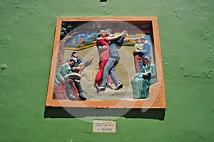 Picturesque city of Caminito Alto relive couple dancing tango tourist place in La Boca Buenos Aires Argentina