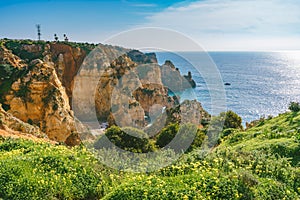 Picturesque cliff walk along the Lagos coastline, Algarve, Portugal