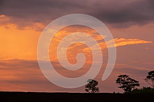 Picturesque cloudscape over a table top mountain at sunset