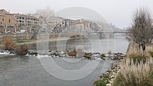 Picturesque embankment of Segre river. City of Balaguer, Spain