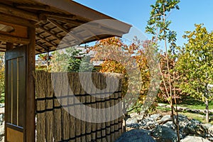 Picturesque fragments of gate above path leading to Tea House in Japanese Garden.