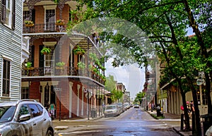 Picturesque French Quarter and pedestrians on the street. Tour of the streets of the French Quarter of New Orleans