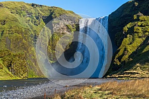 Picturesque full of water big waterfall Skogafoss autumn view, southwest Iceland