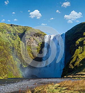 Picturesque full of water big waterfall Skogafoss autumn view, southwest Iceland