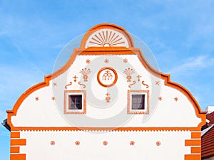 Picturesque gable of old house in Holasovice, small rural village with rustic baroque architecture. Southern Bohemia