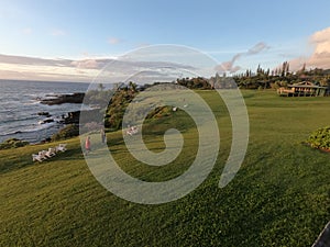 Picturesque golf course by the sea at sunset in Hana Maui Resort