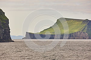 Picturesque green cliffs landscape and atlantic ocean. Faroe islands. Stora Dimun