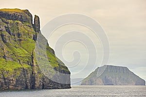 Picturesque green cliffs landscape and atlantic ocean. Faroe islands. Sudoroy