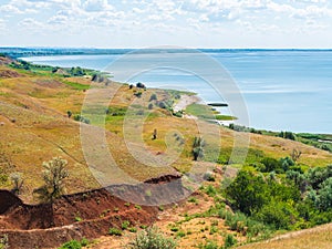 Picturesque hills on the coast of the Taganrog Bay of the Azov Sea on a hot sunny day photo