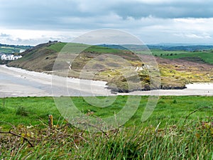 Picturesque hills, a view of the seashore. Cloudy rainy weather. Landscapes along the Wild Atlantic Way. Nature of Northwestern