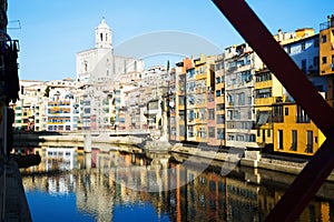 Picturesque houses and church from Eiffel bridge in Gerona.