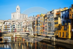 Picturesque houses and church on river Onyar in Gerona