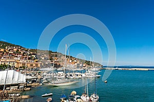 Picturesque Italian coastal town with waterfront property and yachts in the bay