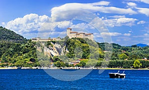 Picturesque lake Lago Maggiore, view of Rocca di Angera castle. Northen Italy