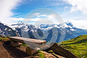 The picturesque landscape with a bench and a view of the mountains in the Swiss Alps, Europe