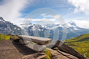 The picturesque landscape with a bench and a view of the mountains in the Swiss Alps, Europe