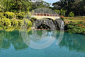 Picturesque landscape with a bridge and a swimming pool. expensive luxury hotel in the tropics. rest in hotel in summer by t