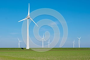 In the picturesque landscape of Flevoland, wind turbines gracefully spin in the green field, harnessing renewable energy