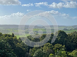 Picturesque landscape with green hills and clouds in a sunny day, New Zealand