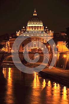 Picturesque landscape of St. Peters Basilica over Tiber by night in Rome, Italy