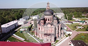 Picturesque landscape with Transfiguration Cathedral and old belfry during restoration in missionary monastery in small