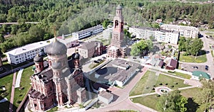 Picturesque landscape with Transfiguration Cathedral and old belfry during restoration in missionary monastery in small