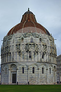 Picturesque landscape view of medieval Pisa Baptistery of St. John. It is Roman Catholic ecclesiastical building