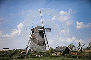 Picturesque landscape with windmills