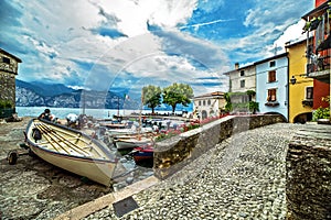 Picturesque Malcesine harbor with boats on Garda lake, Verona, Italy
