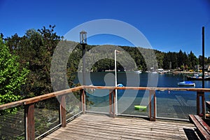 picturesque manzano bay, with luxurious hotels and apartments with docks and boats on lake nahuel huapi y photo